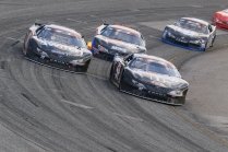 Kyle Busch Motorsports teammates Raphael Lessard (51) and eventual winner Noah Gragson (18) battle for the lead in the early moments. (David Kranak/ Impact Zone Photos)