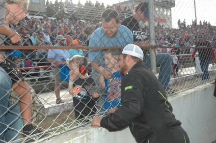 Pensacola native Logan Boyett, who qualified sixth, enjoys some time with fans before the race. (Jim Carson photo)