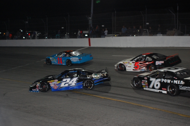 Chance Jewels spins to the inside of the half-mile as Jerick Johnson (76), two-time Pro Late Model podium finisher Loris Hezemans (5) and Dalton Smith speed past him. (Mike Lysakowski/ Motorsport Aspects)