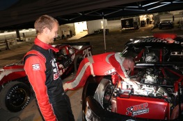 Travis Braden watches his car owner Bill Burba make an adjustment on his Super Late Model. Burba also drove in the modified class.